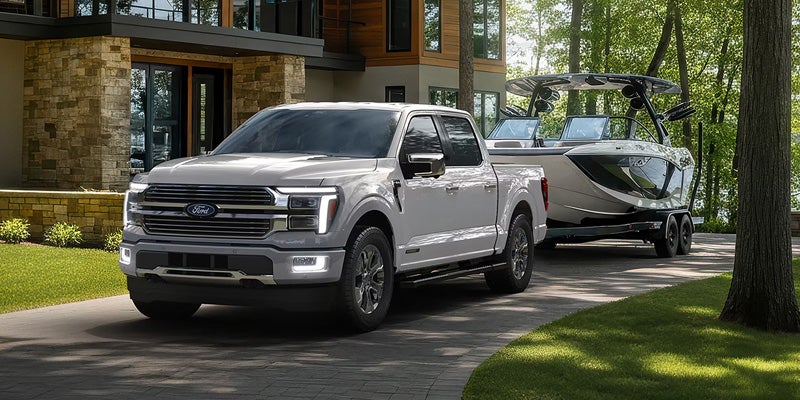 White F-150 towing carrier