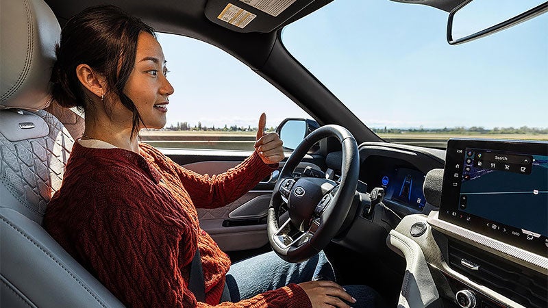 Woman driving 2027 Ford Explorer
